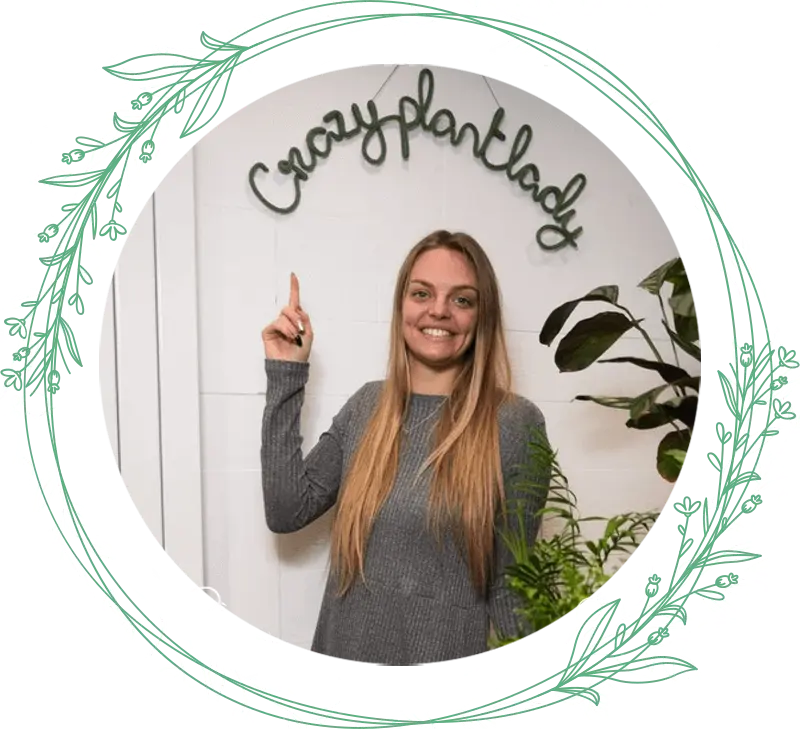 This shows a woman pointing to a crazy plant lady sign