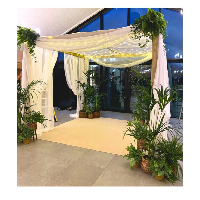 Mandap 14 Modern botanical mandap with white drapes, greenery and fairy lights for an Indian wedding ceremony