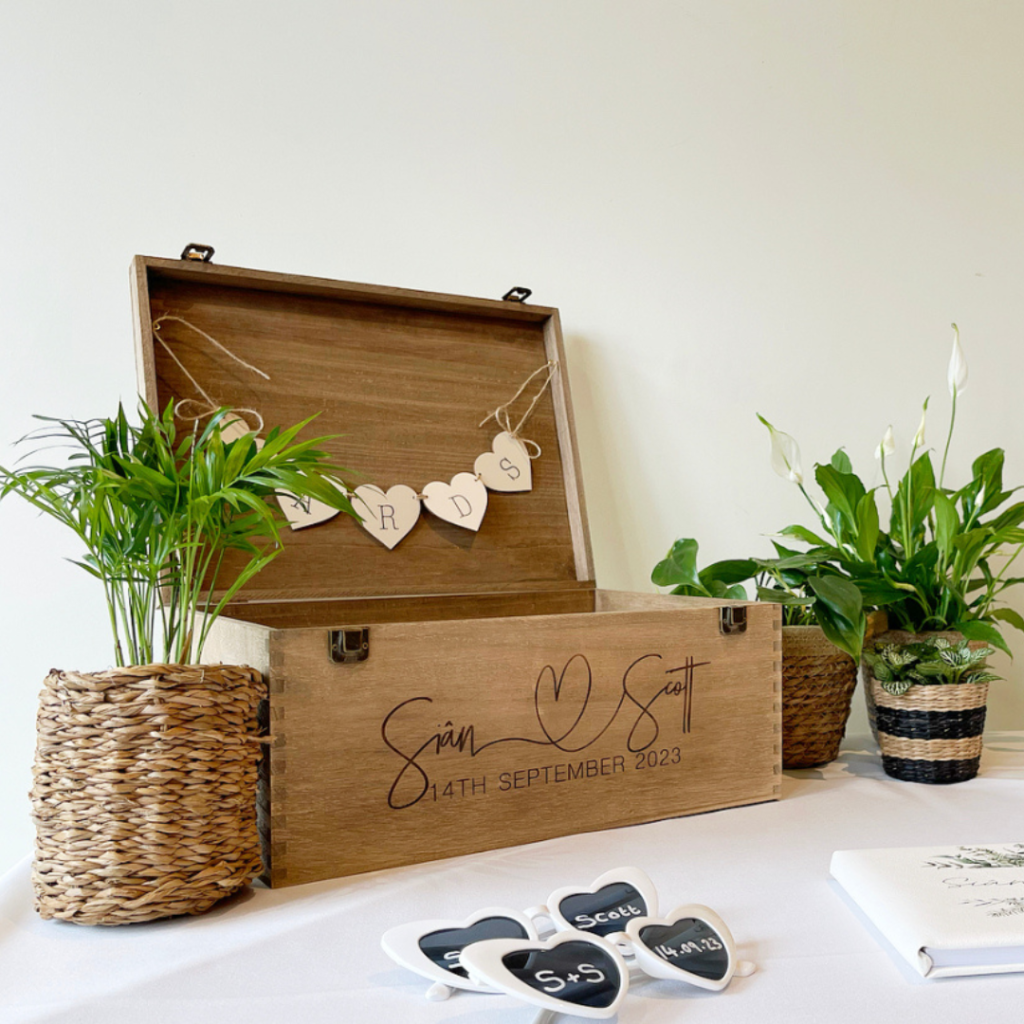 Wedding card and gift table decorated with small living plants